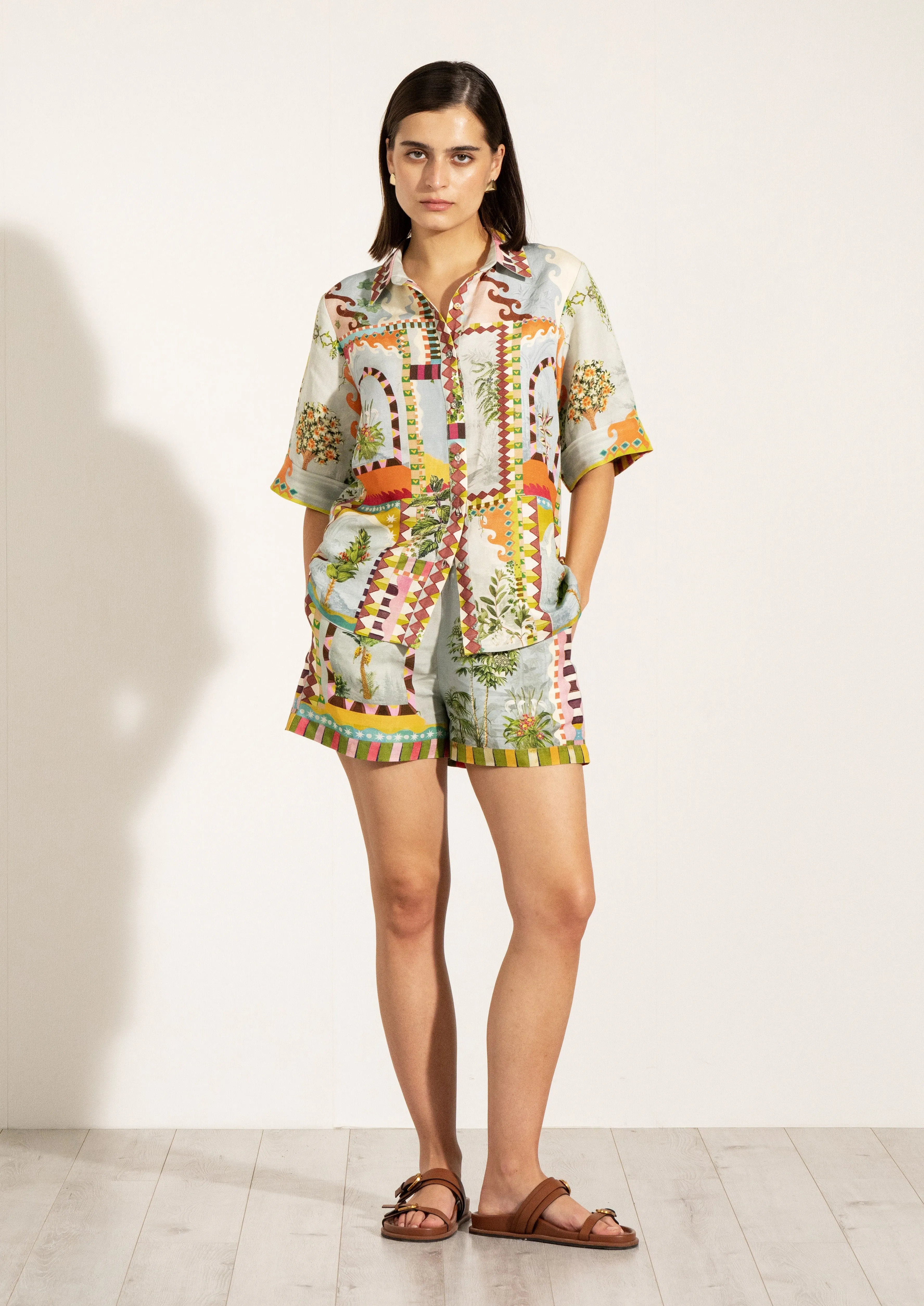 Sable green button-down shirt and shorts